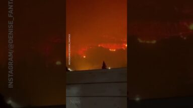 Night sky turns orange from wildfires in Palermo, Italy