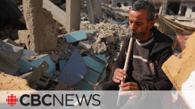 Palestinian flutist embraces music amid destruction in Gaza