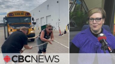 This Strongman competitor is a woman who can move a school bus