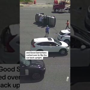 Good Samaritans flip car upright after collision